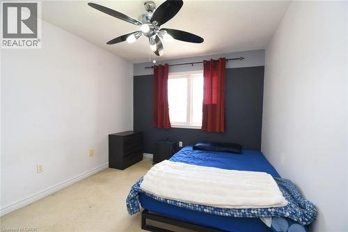 Bedroom featuring light carpet and a ceiling fan - 142 Hawkswood Trail, Hamilton, ON - Indoor Photo Showing Bedroom