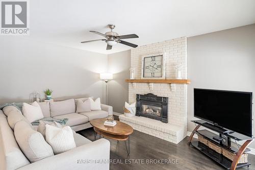 5 Bailey Crescent, Tiny, ON - Indoor Photo Showing Living Room With Fireplace