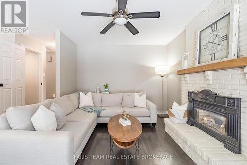 5 Bailey Crescent, Tiny, ON - Indoor Photo Showing Living Room With Fireplace