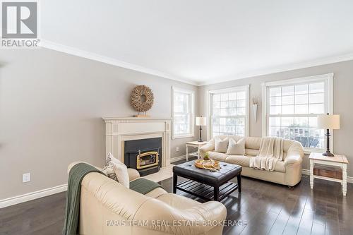 5 Bailey Crescent, Tiny, ON - Indoor Photo Showing Living Room With Fireplace