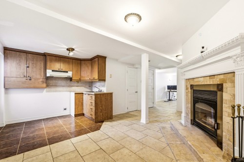 Dining Room - 3737 Boul. Henri-Bourassa O., Montréal (Saint-Laurent), QC - Indoor Photo Showing Kitchen With Fireplace