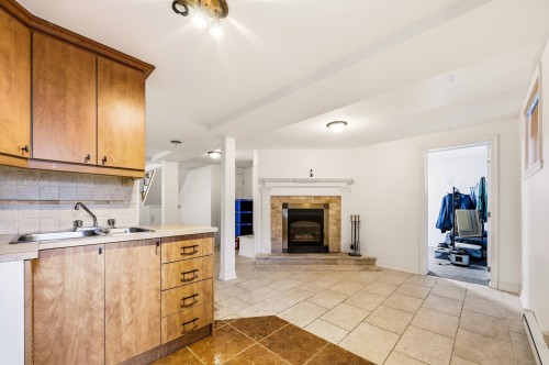 Kitchen - 3737 Boul. Henri-Bourassa O., Montréal (Saint-Laurent), QC - Indoor Photo Showing Kitchen With Fireplace With Double Sink