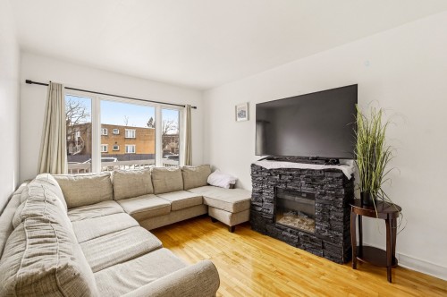 Living Room - 3737 Boul. Henri-Bourassa O., Montréal (Saint-Laurent), QC - Indoor Photo Showing Living Room With Fireplace