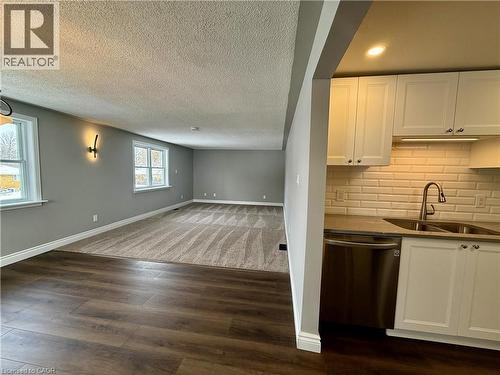 View of Living Room and Dining Room - 162 Ninth Avenue, Kitchener, ON - Indoor Photo Showing Kitchen With Double Sink