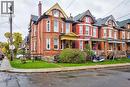 Victorian house with a chimney, brick siding, and covered porch - 44 Ashley Street, Hamilton, ON  - Outdoor With Facade 