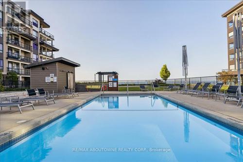 102 - 40 Esplanade Lane, Grimsby, ON - Outdoor With In Ground Pool