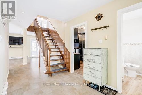 Wood staircase with modern open railing - 39 Turtle Path, Ramara, ON - Indoor Photo Showing Other Room