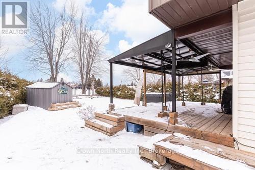 Large covered deck overlooking the water. - 39 Turtle Path, Ramara, ON - Outdoor With Deck Patio Veranda