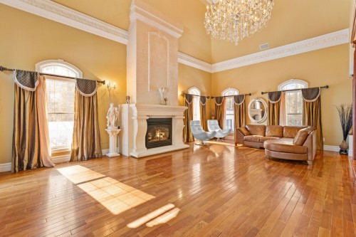 Living Room - 1185 Rue St-Andrews, Mascouche, QC - Indoor With Fireplace