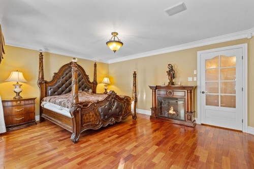 Master Bedroom - 1185 Rue St-Andrews, Mascouche, QC - Indoor Photo Showing Bedroom With Fireplace