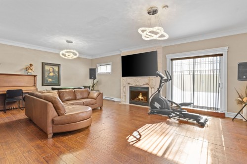 Family Room - 1185 Rue St-Andrews, Mascouche, QC - Indoor Photo Showing Living Room With Fireplace