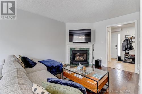 1896 Woodgate Court, Oshawa, ON - Indoor Photo Showing Living Room With Fireplace