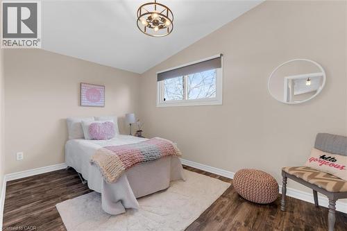 Bedroom featuring lofted ceiling, wood finished floors, and hanging lights - 77 Lawfield Drive, Hamilton, ON - Indoor Photo Showing Bedroom