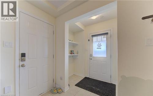 Entryway with light tile patterned floors and baseboards - 9 Outlook Terrace, Kitchener, ON - Indoor Photo Showing Other Room