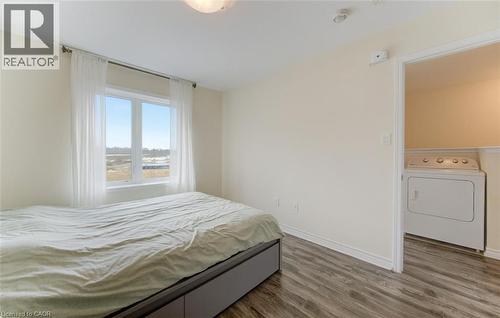 Bedroom with washer / dryer and dark wood-type flooring - 9 Outlook Terrace, Kitchener, ON - Indoor Photo Showing Bedroom