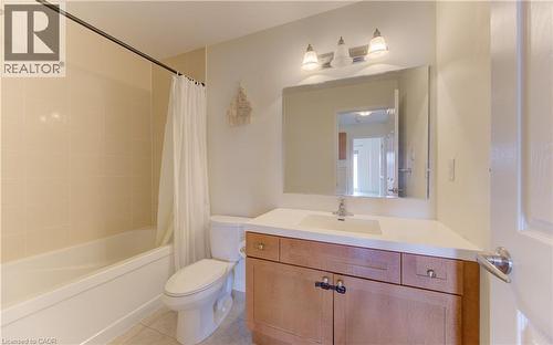 Bathroom featuring vanity, light tile patterned flooring, and shower / bath combination with curtain - 9 Outlook Terrace, Kitchener, ON - Indoor Photo Showing Bathroom