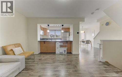 Living area featuring dark wood-style flooring and baseboards - 9 Outlook Terrace, Kitchener, ON - Indoor Photo Showing Living Room