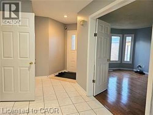 Corridor with light tile patterned flooring - 486 Dicenzo Drive, Hamilton, ON - Indoor Photo Showing Other Room