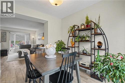 Dining space with light wood-type flooring and a textured ceiling - 21 Greystone Crescent, St. Catharines, ON - Indoor Photo Showing Dining Room