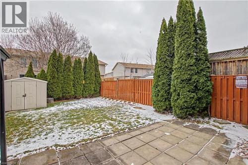 Snow covered patio featuring a fenced backyard, a storage unit, and a patio area - 21 Greystone Crescent, St. Catharines, ON - Outdoor
