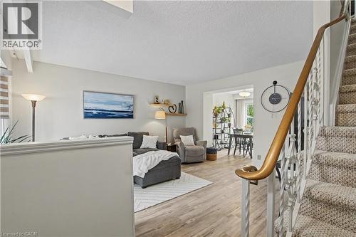 Living area featuring a textured ceiling and light wood finished floors - 21 Greystone Crescent, St. Catharines, ON - Indoor Photo Showing Other Room