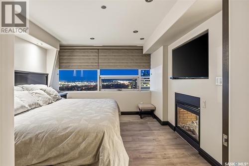Ph208 1914 Hamilton Street, Regina, SK - Indoor Photo Showing Bedroom With Fireplace