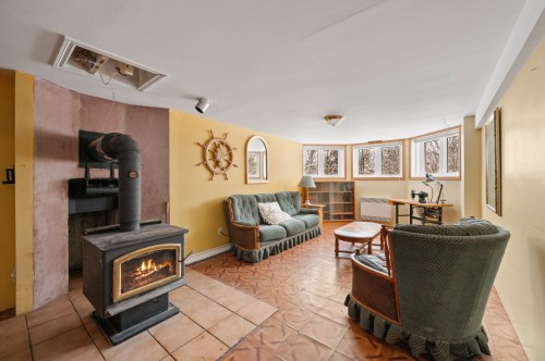 Salle familiale - 109 Rue St-Laurent, Lac-Simon, QC - Indoor Photo Showing Other Room With Fireplace