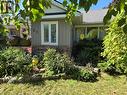 View of side of property featuring board and batten siding and stone siding - 27 Hepburn Avenue, St. Thomas, ON  - Outdoor 