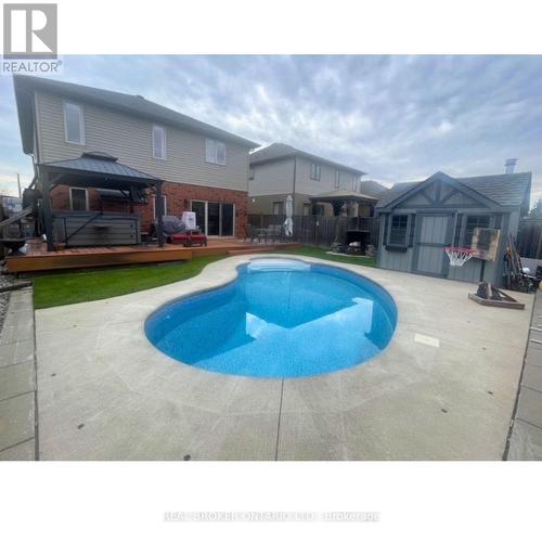 This is where your summer happens - 50 Gaiser Road, Welland (Coyle Creek), ON - Outdoor With In Ground Pool With Deck Patio Veranda