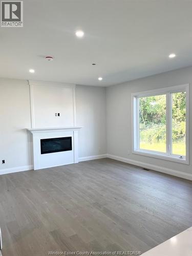 31 Eagle, Leamington, ON - Indoor Photo Showing Other Room With Fireplace