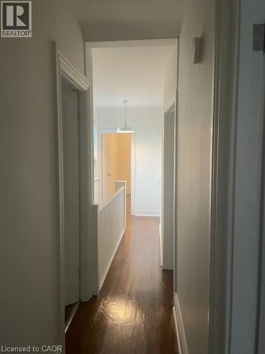 Hall featuring dark wood-type flooring and baseboards - 18 Mulberry Street, Hamilton, ON - Indoor Photo Showing Other Room