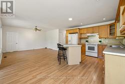 Kitchen w eating bar + living room area - 