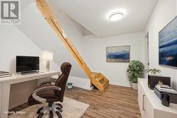 Lower level landing, virtually staged as office - 