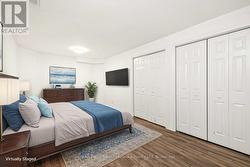 Lower level bedroom, virtually staged, dbl closets - 