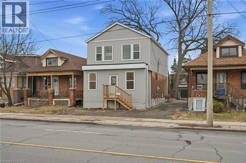 View of front of house featuring a porch and brick siding - 1278 Main Street E, Hamilton, ON - Outdoor With Facade