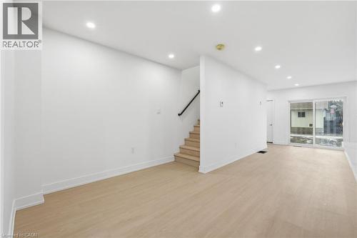 Unfurnished living room featuring recessed lighting and light wood-style flooring - 1278 Main Street E, Hamilton, ON - Indoor Photo Showing Other Room