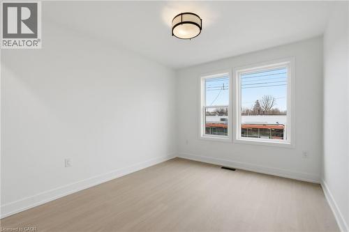 Empty room featuring baseboards and light wood-style floors - 1278 Main Street E, Hamilton, ON - Indoor Photo Showing Other Room