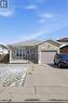 Single story home featuring driveway, brick siding, and a garage - 513 Rexford Drive, Hamilton, ON  - Outdoor 