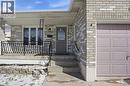 Property entrance with brick siding, a porch, and a garage - 513 Rexford Drive, Hamilton, ON  - Outdoor 