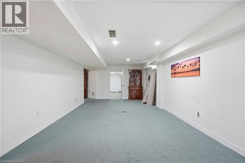 Finished below grade area featuring carpet floors and recessed lighting - 513 Rexford Drive, Hamilton, ON - Indoor