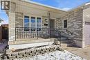 Entrance to property featuring a porch, brick siding, and an attached garage - 513 Rexford Drive, Hamilton, ON  - Outdoor With Deck Patio Veranda 