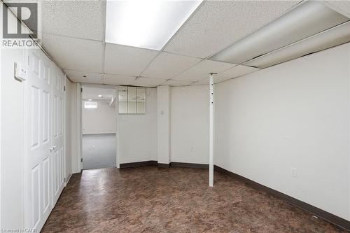 Finished basement with a paneled ceiling and baseboards - 513 Rexford Drive, Hamilton, ON - Indoor Photo Showing Other Room