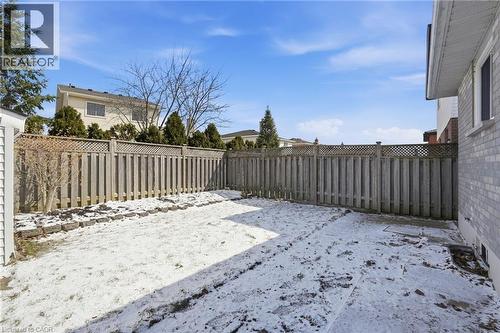 Yard covered in snow featuring a fenced backyard - 513 Rexford Drive, Hamilton, ON - Outdoor