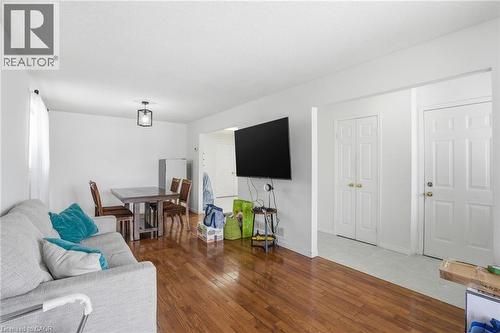 Living room with dark wood finished floors - 513 Rexford Drive, Hamilton, ON - Indoor