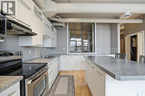 301 12 23Rd Street E, Saskatoon, SK - Indoor Photo Showing Kitchen With Double Sink