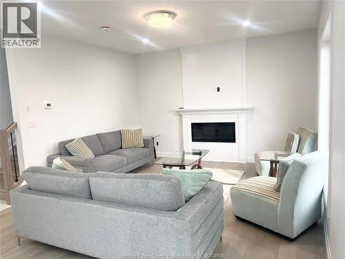 33 Eagle, Leamington, ON - Indoor Photo Showing Living Room With Fireplace