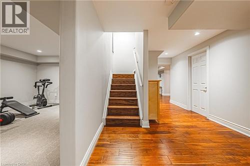 Staircase featuring wood-type flooring and recessed lighting - 120 Valiant Circle, Hamilton, ON - Indoor Photo Showing Other Room