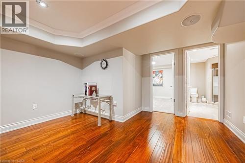 Entrance foyer with a tray ceiling, light wood finished floors, and crown molding - 120 Valiant Circle, Hamilton, ON - Indoor Photo Showing Other Room