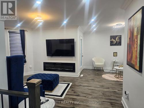 1680 Samuelson Circle, Mississauga, ON - Indoor Photo Showing Other Room With Fireplace