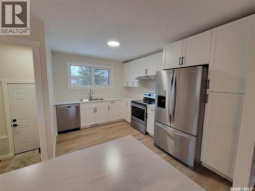 357 5Th Avenue W, Unity, SK - Indoor Photo Showing Kitchen With Double Sink